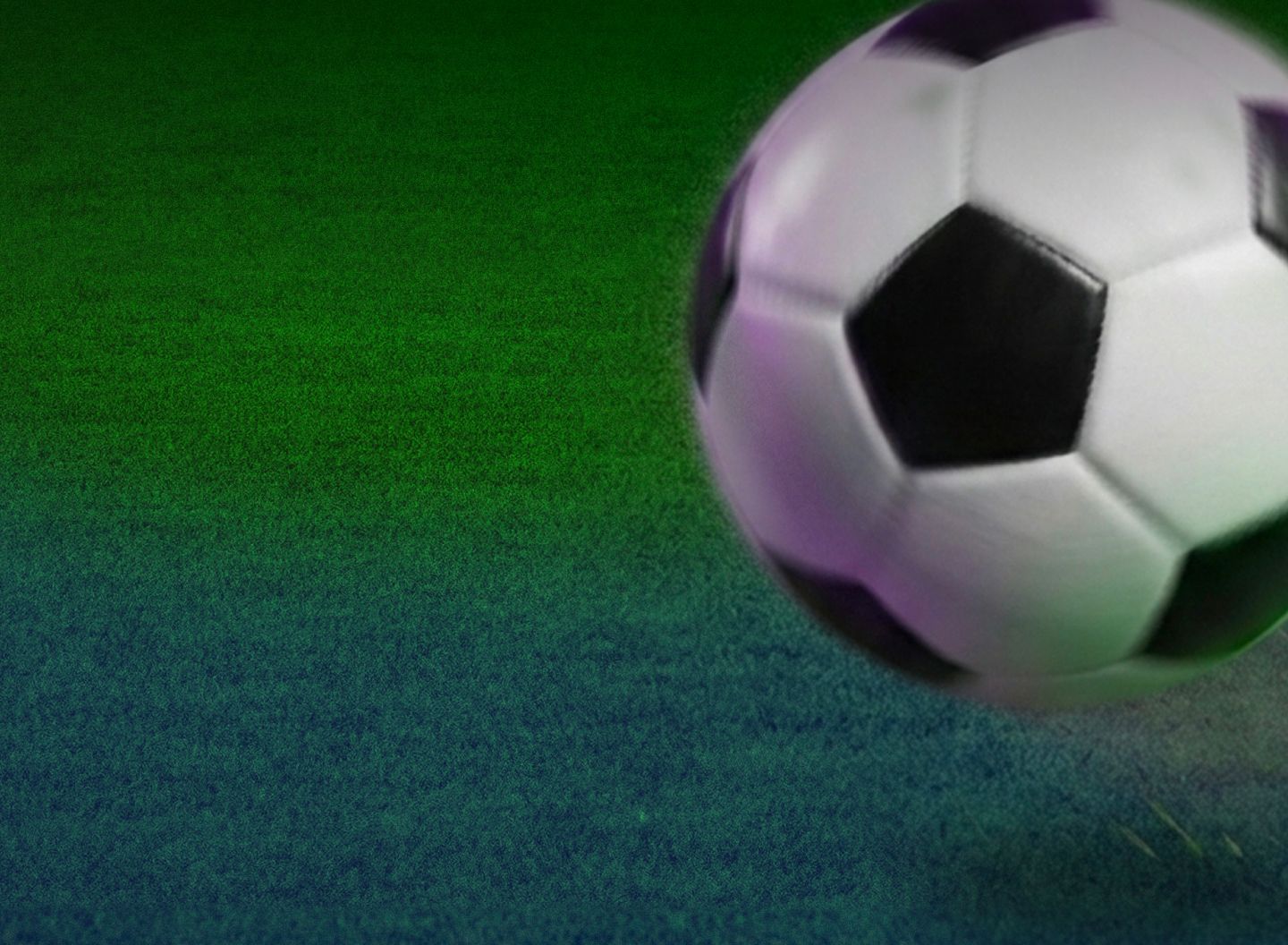 Futball-labda a füvön
